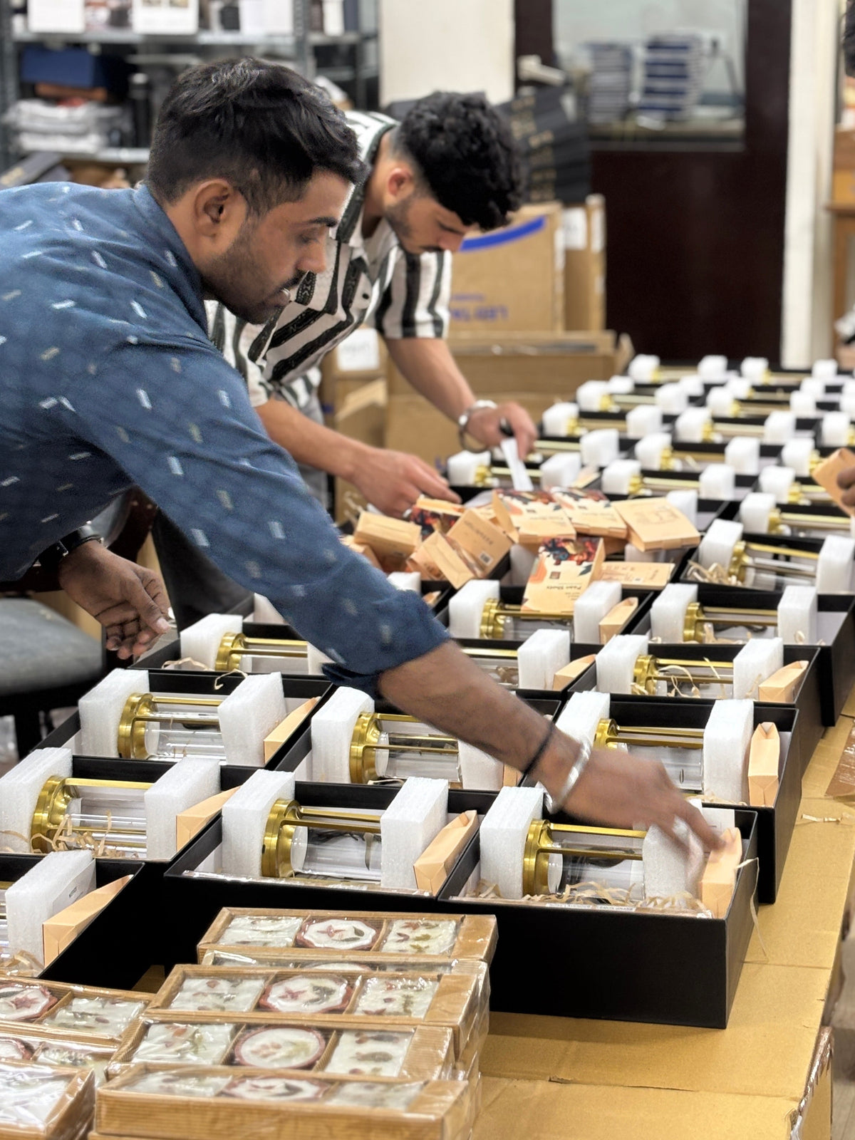 Team assembling customized corporate gift boxes